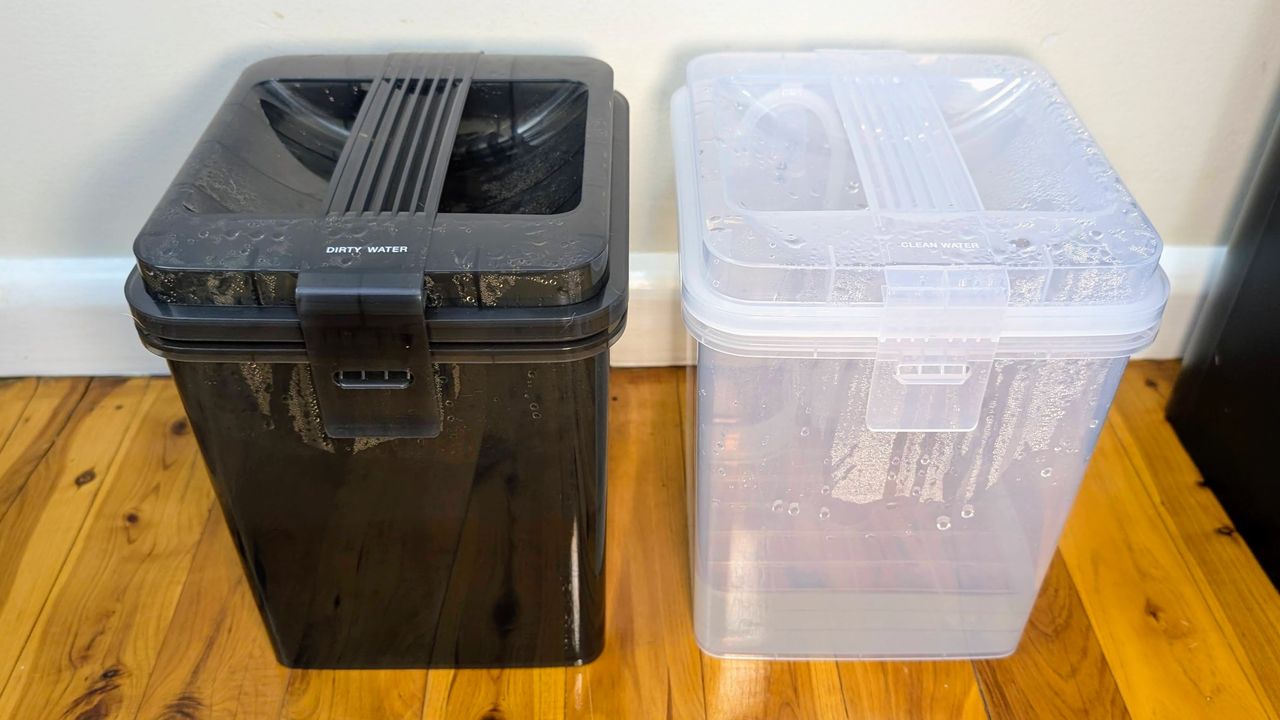 Ecovacs X5 Pro Omni clean and dirty water containers removed from the base station