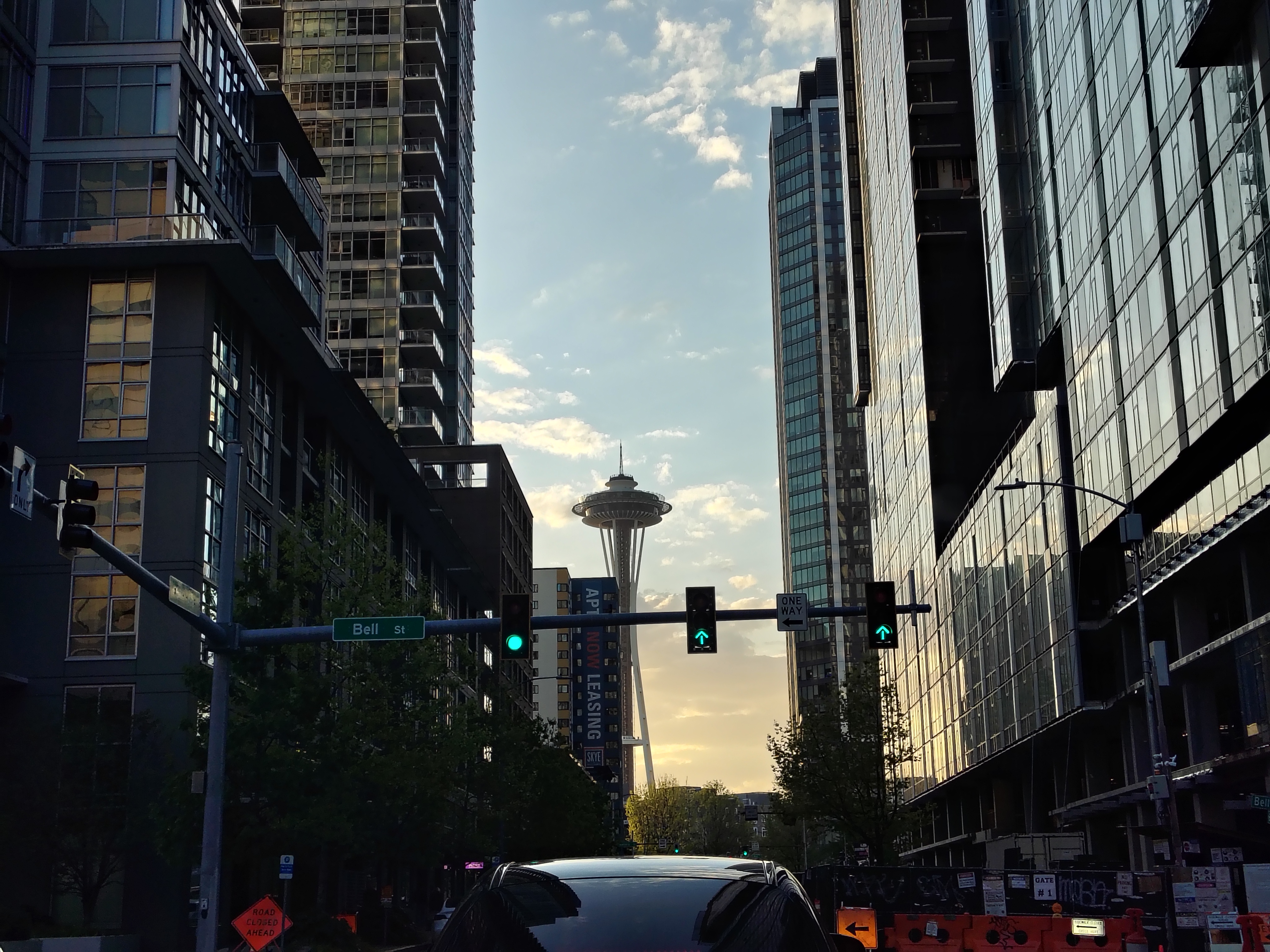 The Seattle Space Needle at sunset between two buildings