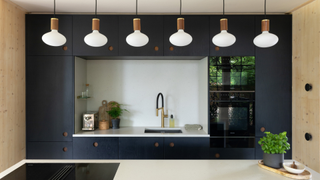 kitchen with pendant lights, sink and island