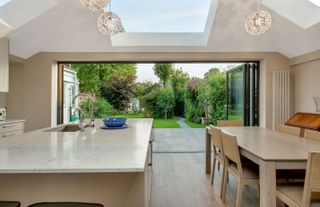 rear kitchen extension with large glass sliding doors and views onto the garden by mulroy arhictects