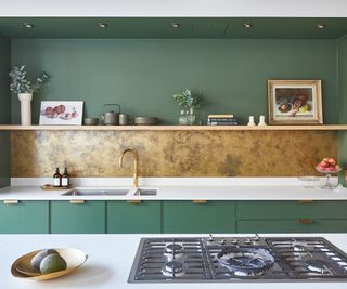 modern green kitchens with brass full width splashback with shelf