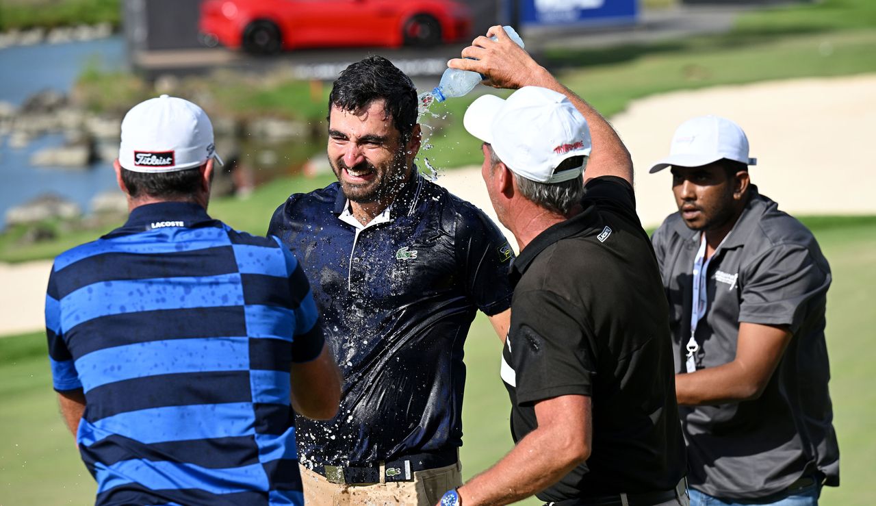 Rozner gets covered in water and champagne