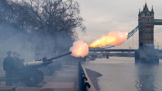 Members of the Honourable Artillery Company fire a 62 round royal gun salute from the Gun Wharf outside the Tower of London