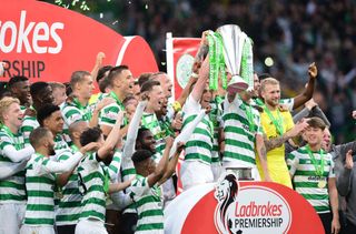 Celtic players celebrate winning their eighth Scottish Premiership title in a row in May 2019.