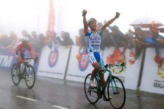 Jonathan Monsalve (Androni Giocattoli) celebrates his victory in the fog atop the Genting Highlands.