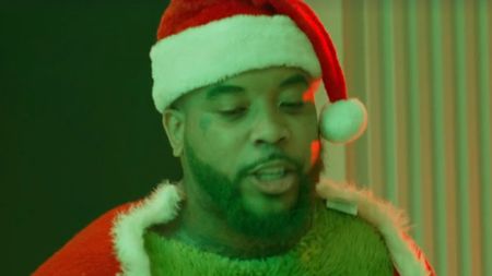 The Grinch dressed as Santa