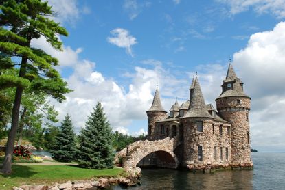 castle on Heart Island during the summer with a bright blue sky and green trees