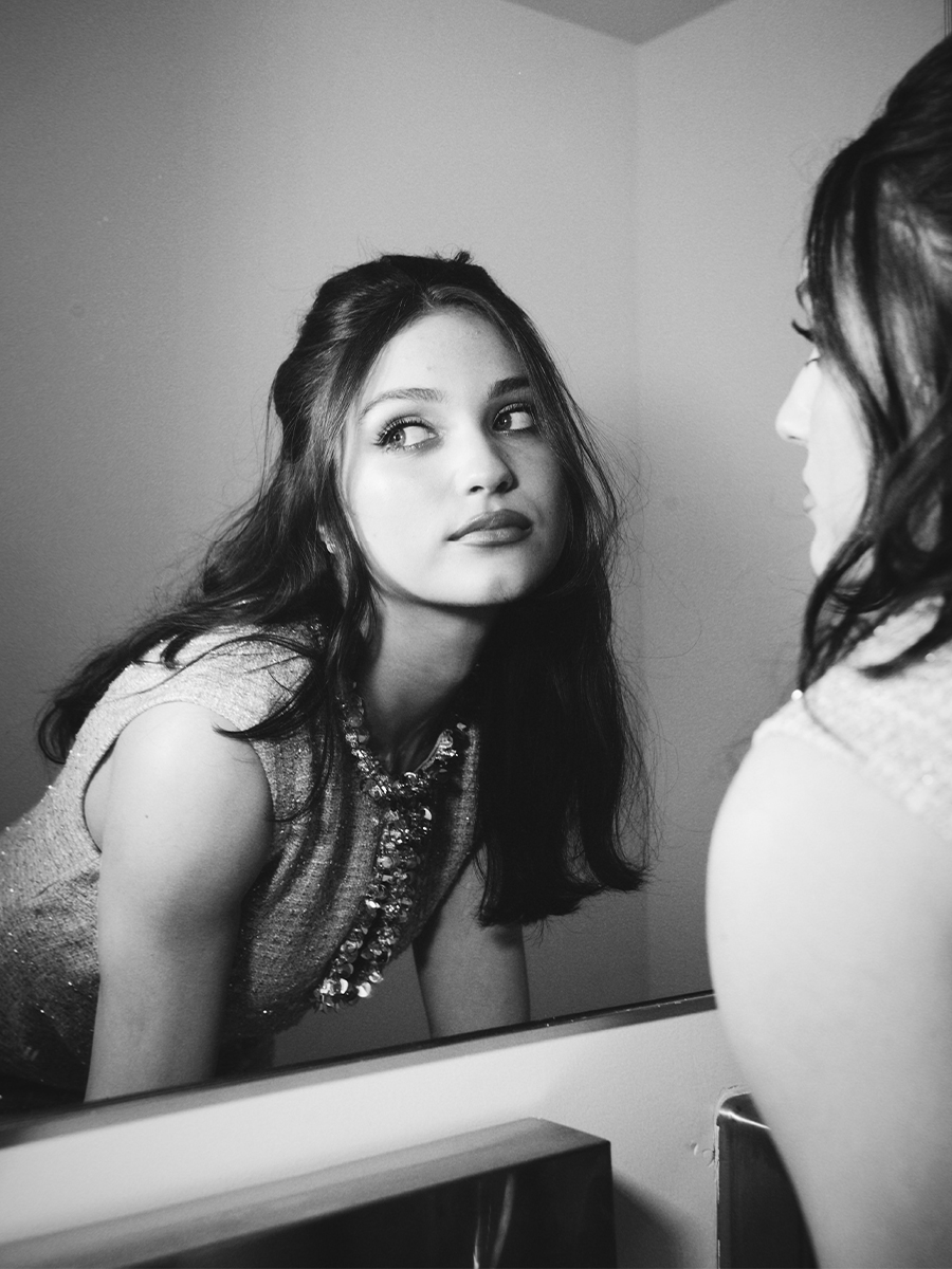 Actor Izzy G. posing in front of mirror.