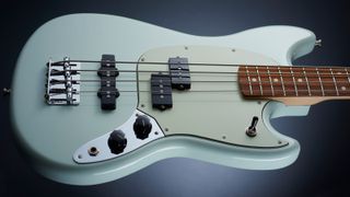 Fender Player Mustang bass on dark blue background