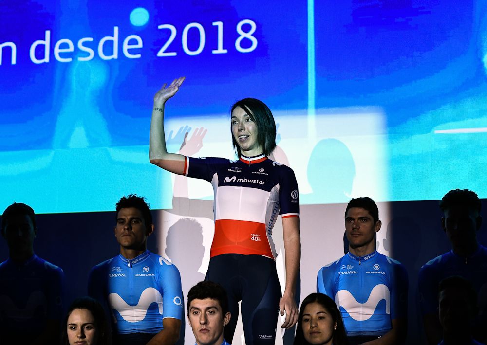 French champion Aude Biannic waves during the presentation of Spain's Movistar Team