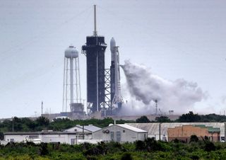 A SpaceX Falcon 9 rocket vents during fueling about 15 minutes before the launch of the Starlink 9 mission was scrubbed due to lightning in the area of Launch Complex 39A at NASA's Kennedy Space Center in Florida, on July 8, 2020. The rocket was scheduled to lift off at 11:54 a.m. EDT (1554 GMT) on the Starlink 9 mission, the 10th flight in building the Starlink satellite constellation.