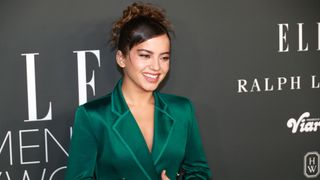 Isabela Merced smiles for the cameras as she walks the red carpet at Elle's Women in Hollywood Celebration 2023