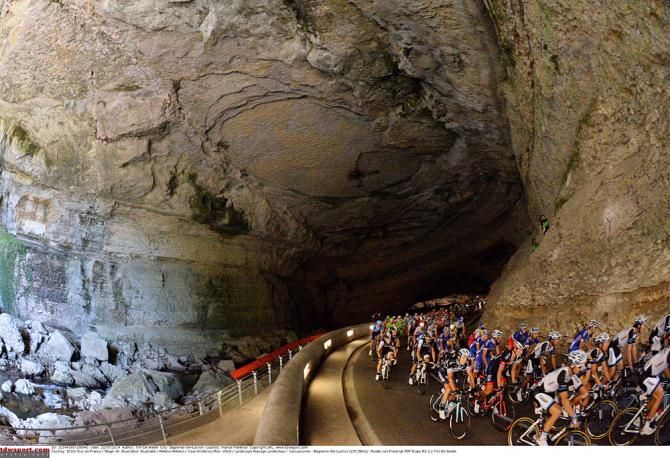 The Tour de France peloton rolls through a tunnel during stage 16.
