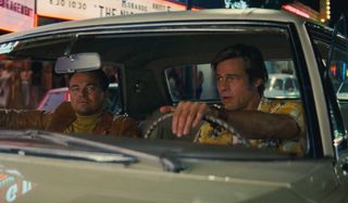 Once Upon A Time In Hollywood Leonardo DiCaprio and Brad Pitt driving through the strip at night