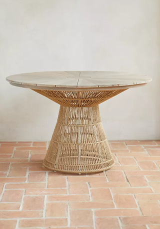 Glass top outdoor dining table from Anthropologie.