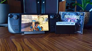 Prince of Persia: Sands of Time running on Steam Deck next to copies of original on Sega CD and Master System