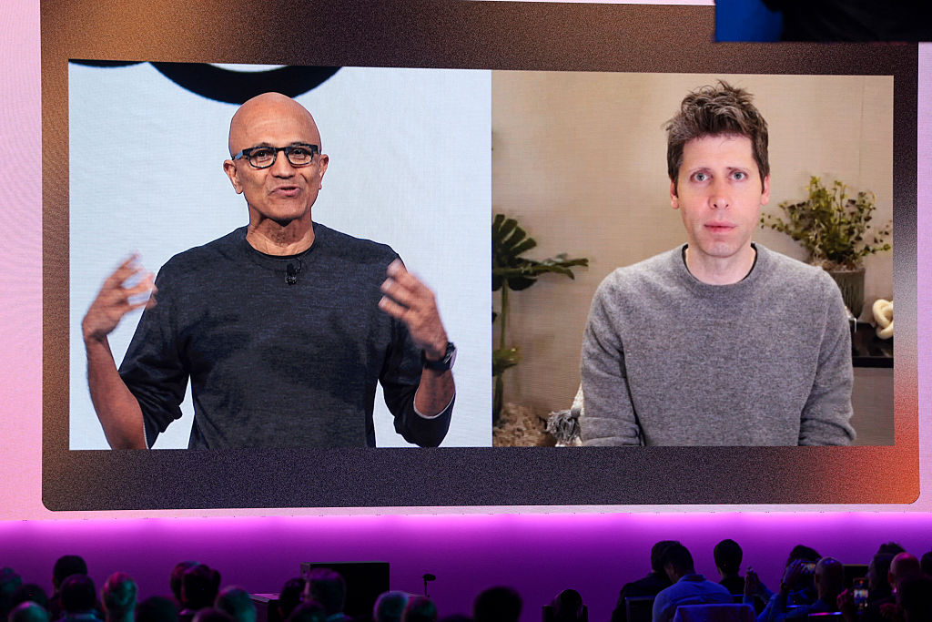 Microsoft Chairman and CEO Satya Nadella speaks with OpenAI CEO Sam Altman