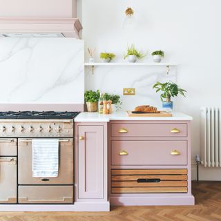 pink kitchen with marble tops