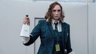 Gwendoline Christie's mystery character holding a cowbell in Severance season 2