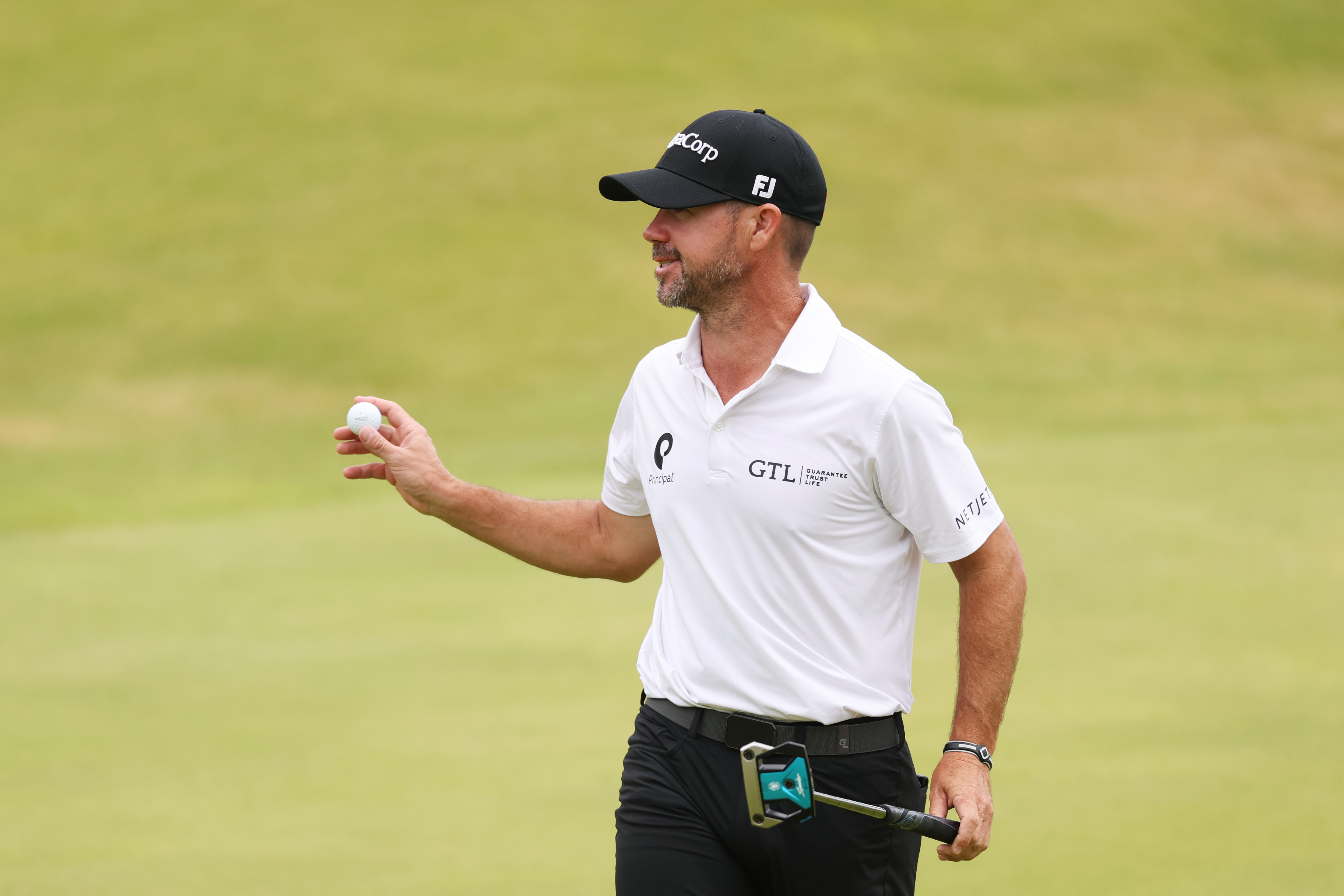 Brian Harman waves to the crowd at The Open
