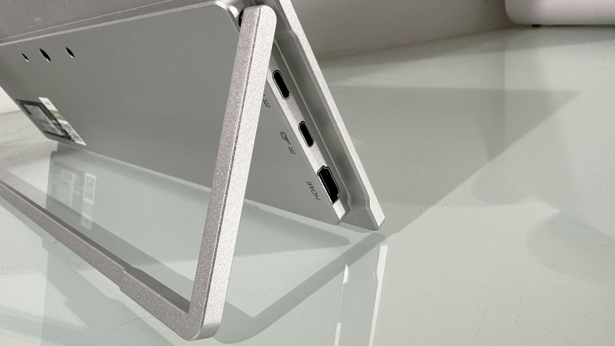Testing the Acer ProDesigner PE160WUT in a home office next to a MacBook