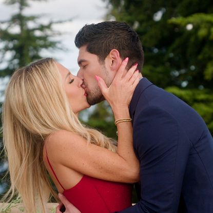 vanessa and logan kiss at the commitment ceremony on an outdoor balcony in age of attraction 