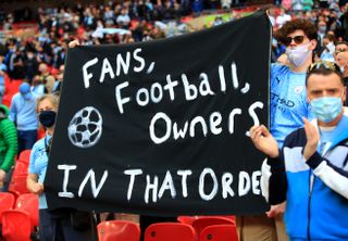 Manchester City fans hold up an anti-Super League banner at last month's Carabao Cup final