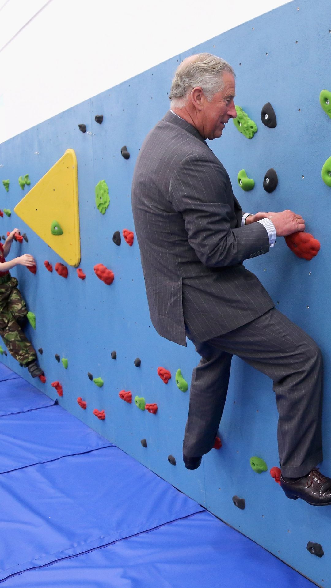 King Charles rock climbing.