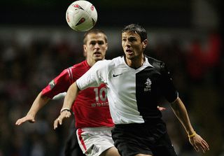 Michael Owen of England battles with Khalid Boulahrouz of Holland during the International Friendly match between England and Holland at Villa Park on February 9, 2005 in Birmingham, England.