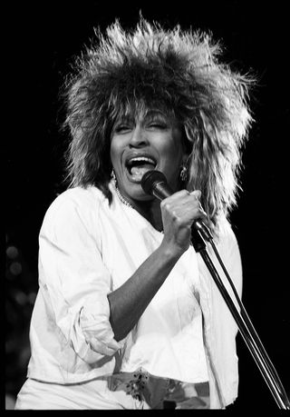 American R&B and Pop singer Tina Turner (born Anna Mae Bullock) performs, during her 'Private Dancer' tour, onstage at the Castle Farms Music Theater, Charlevoix, Michigan, August 31, 1985.
