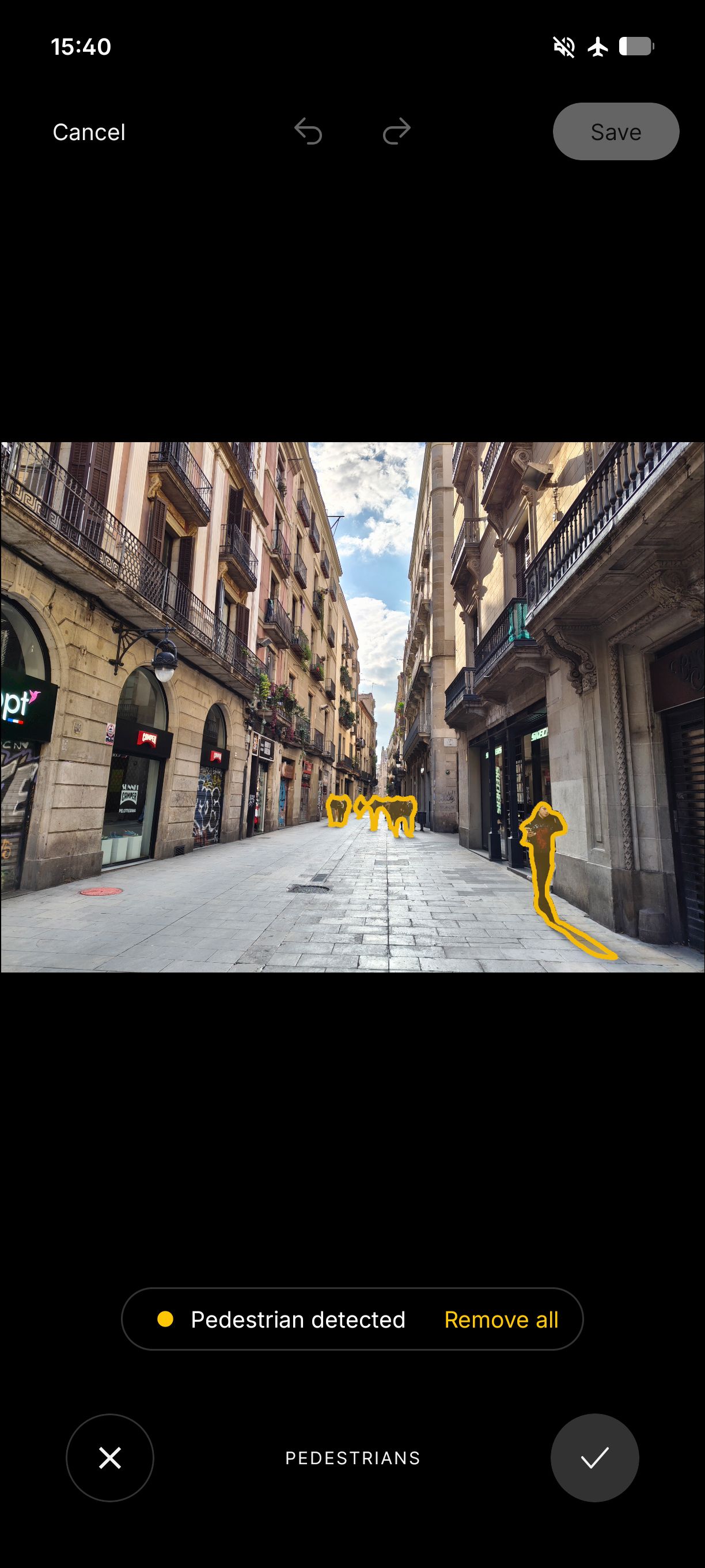 Screenshot of the Nothing Phone (4a) AI object removal tool highlighting detected pedestrians in a city street photo.