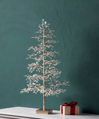 Crystal & Bead Champagne Tabletop Tree on mantel, blue background