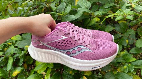 Person holding the Saucony Ride 17 running shoes 