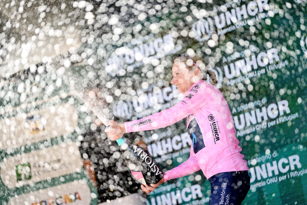 ALDENO ITALY JULY 08 Annemiek Van Vleuten of Netherlands and Movistar Team Pink Leader Jersey celebrates at podium with champagne during the 33rd Giro dItalia Donne 2022 Stage 8 a 1047km stage from Rovereto to Aldeno GiroDonne UCIWWT on July 08 2022 in Aldeno Italy Photo by Dario BelingheriGetty Images