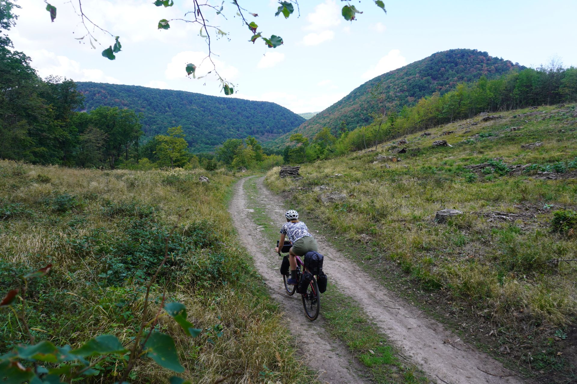 Image shows Anna cycling north out of Budapest towards the Visegrád Citadel.