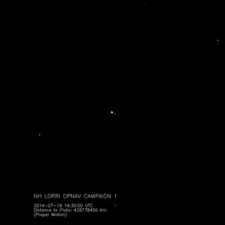 A still image from an animated GIF show New Horizon spacecraft's view of Charon orbiting Pluto in July 2014.