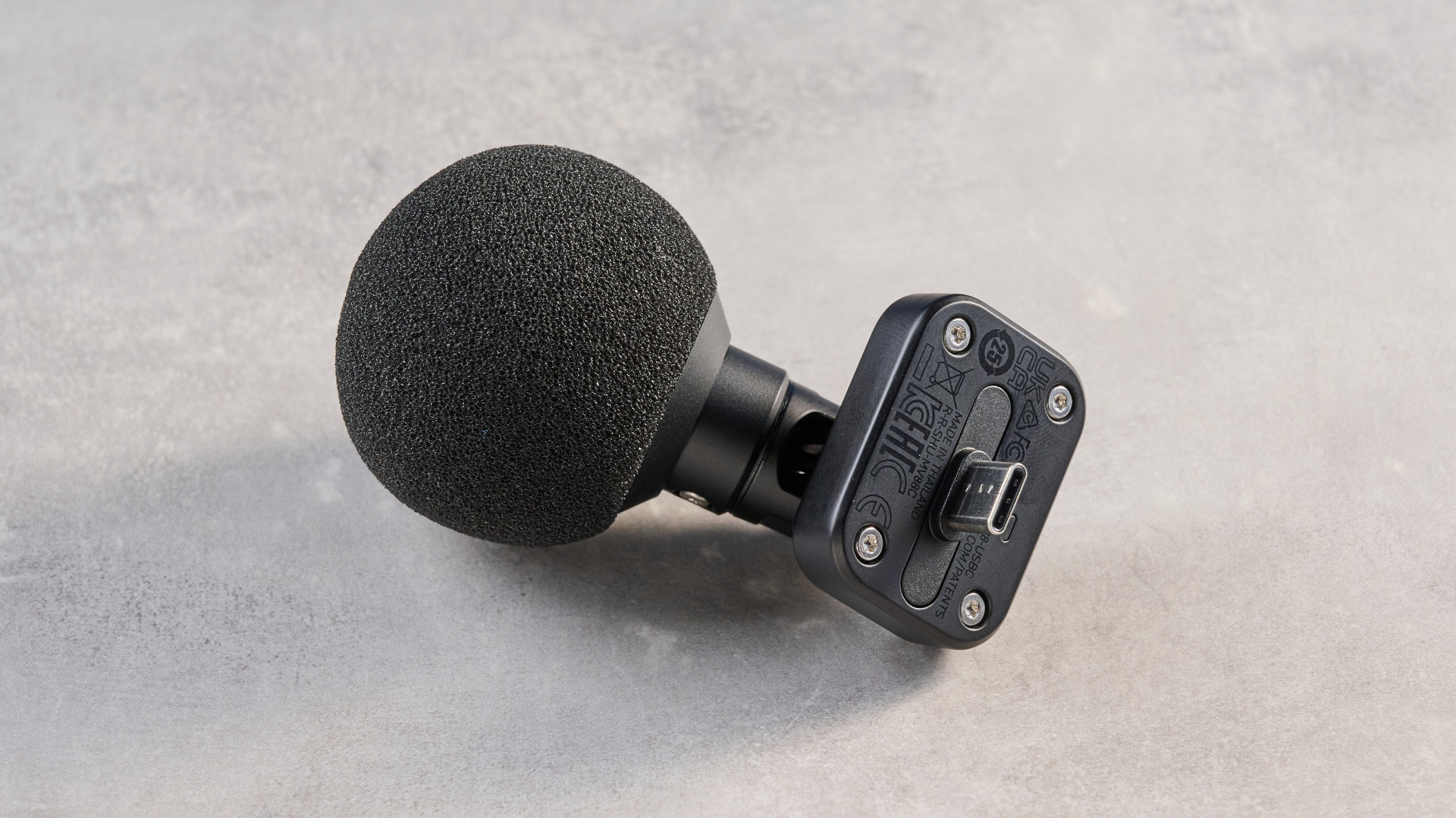 the shure mv88 usb-c microphone photographed against a blue tom's guide background and shown connected to a google pixel 10 pro