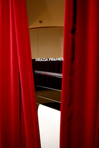 A theatre which says Prada Frames