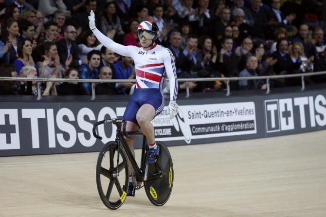 Britain's Kian Emadi-Coffin gives the 5,000 strong crowd a wave