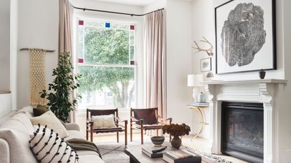 Eclectic white living room in inspiring Victorian renovation