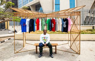 Bamboo kiosk installed in Lagos by Waf skating brand and NMBello studio, with colourful clothes hanging from its racks