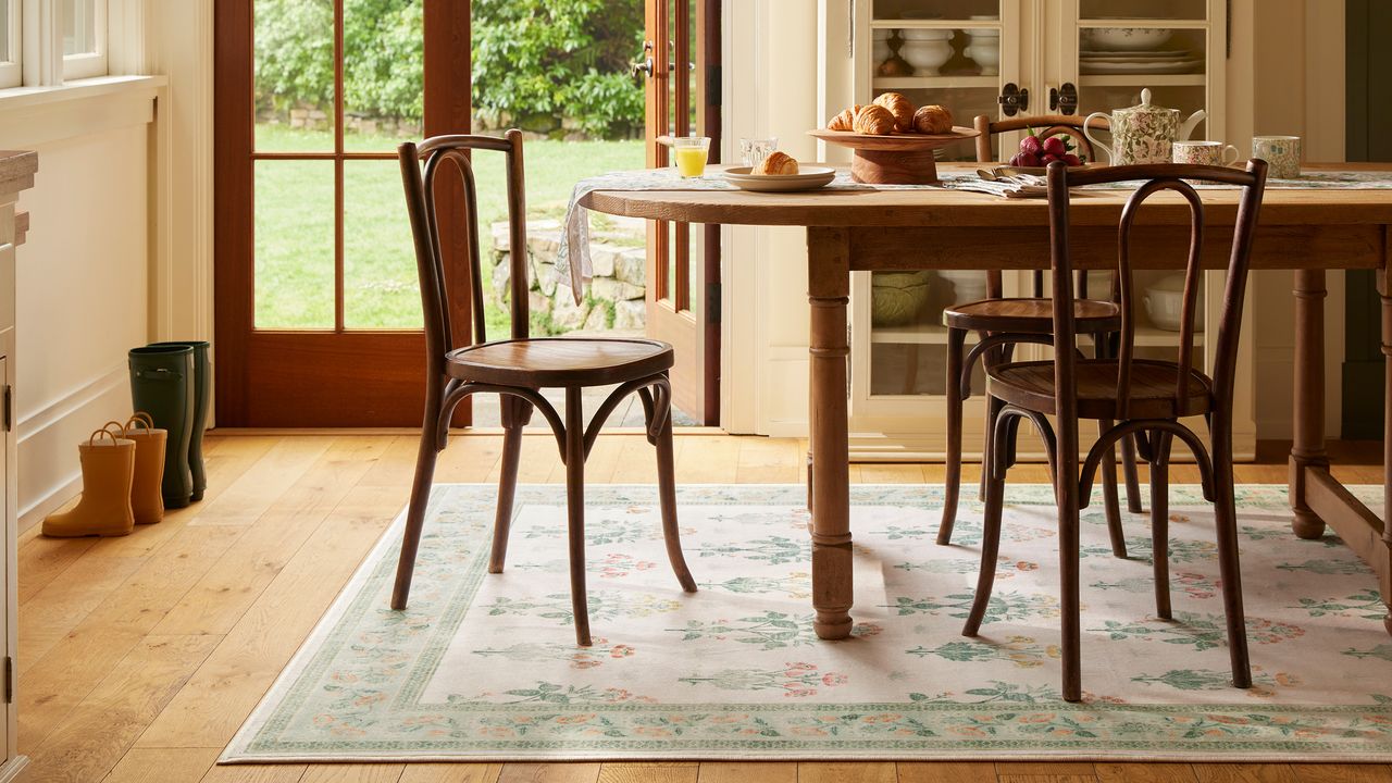 Kitchen table on light, floral, pastel rug