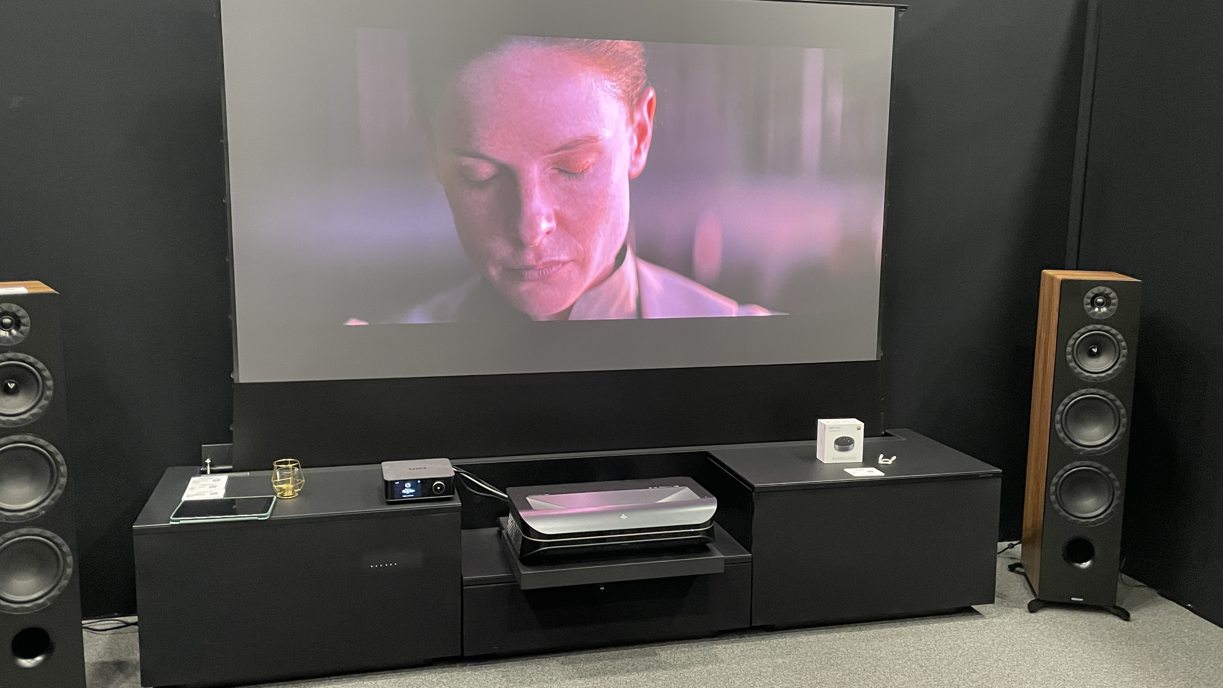 A TV screen showing a scene from Dune: Part 2 with Elipson stereo speakers at the Paris Audio Show