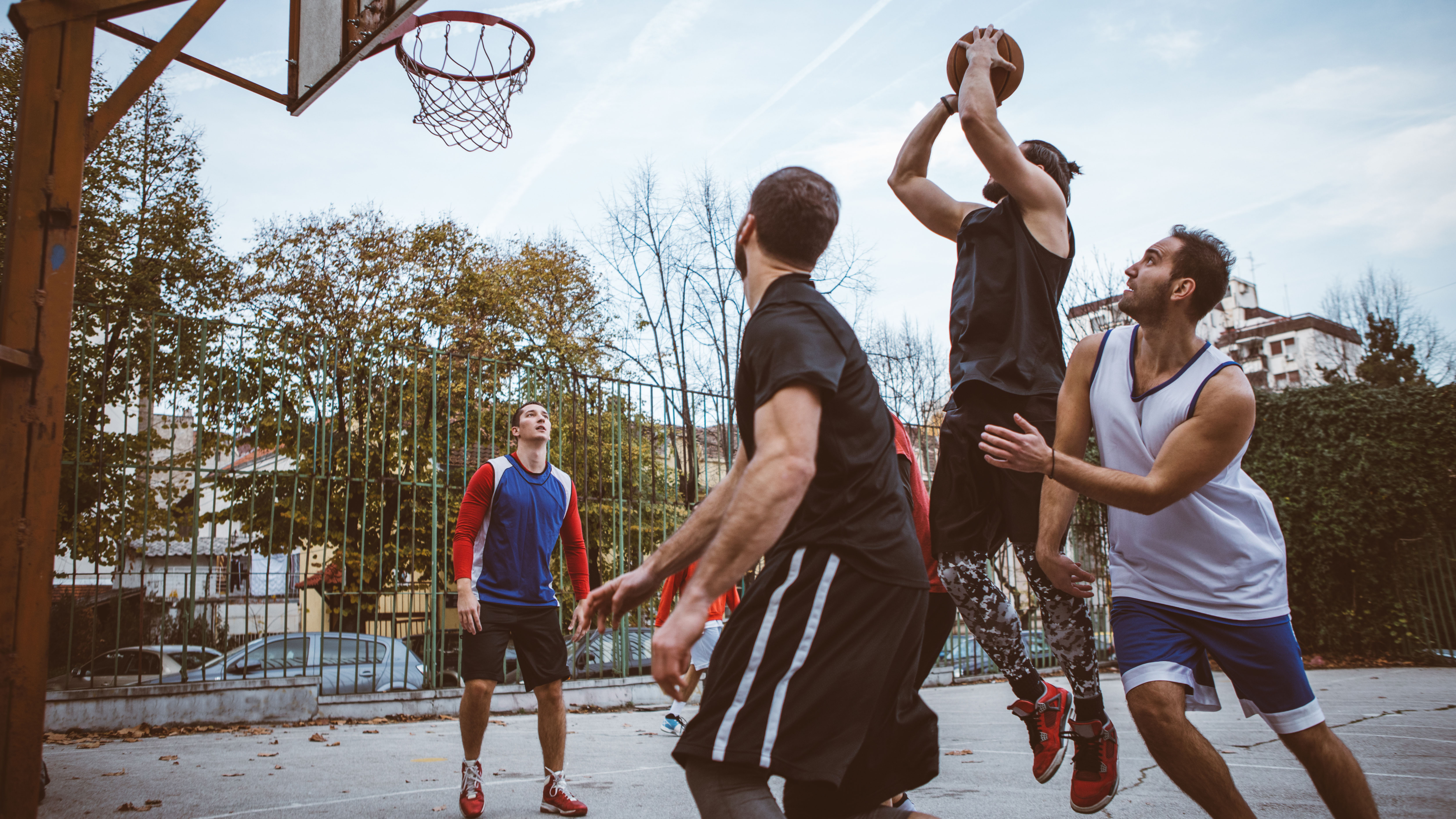 Group of friends playing basketball