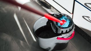 picture of a mop and bucket in kitchen