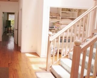 hallway with wooden floor and stairs