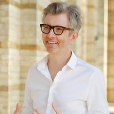 Gareth Malone stood in a cloister