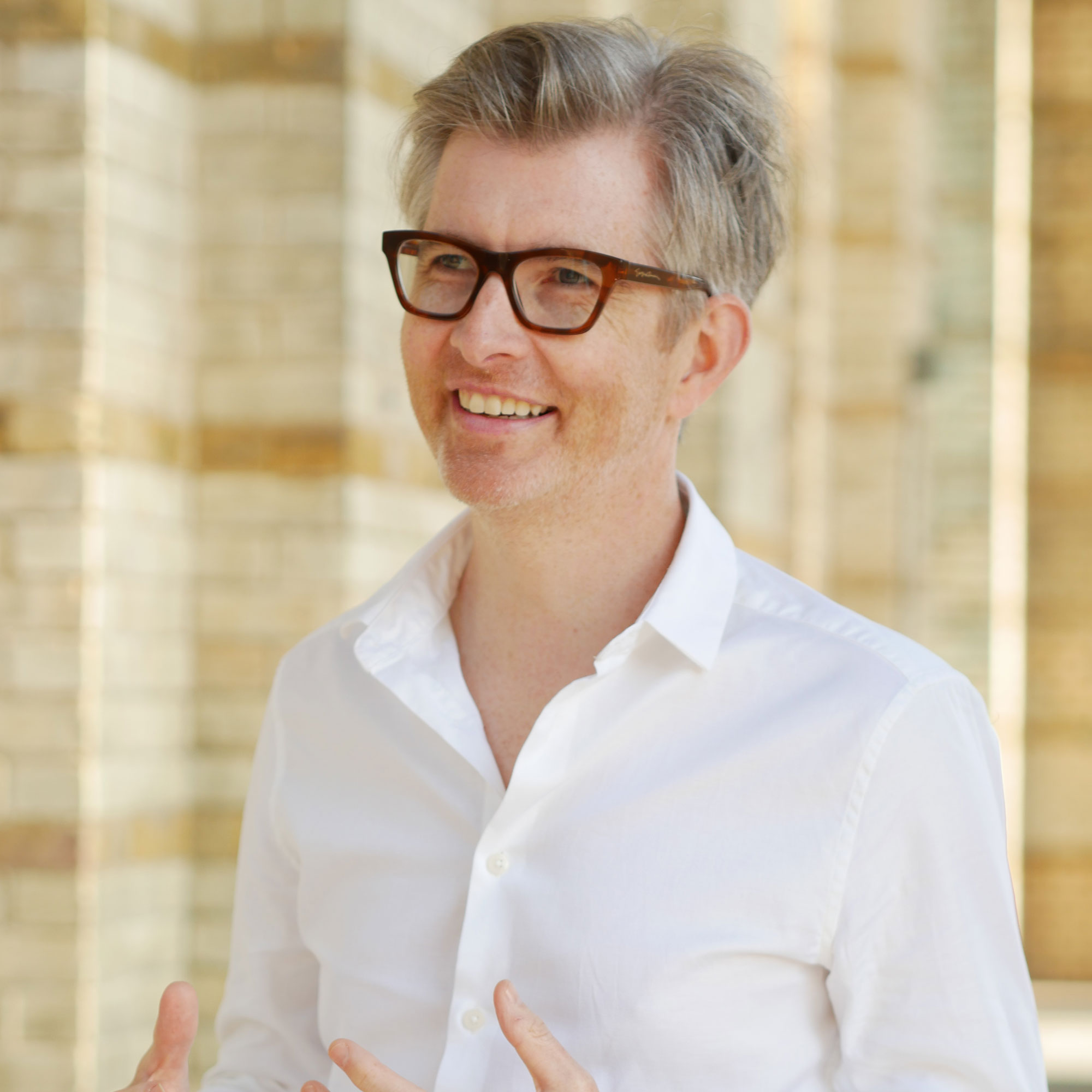 Gareth Malone stood in a cloister