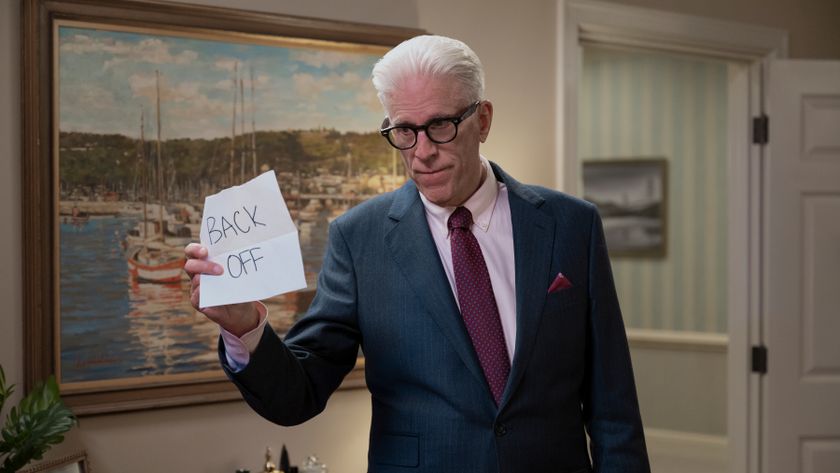 Charles holds up a note saying &#039;Back off&#039; in A Man on the Inside.