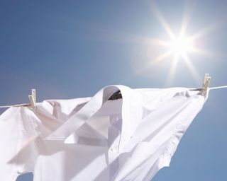 white shirt drying on line in sun